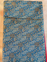 Floral patterned fabric on a wooden surface