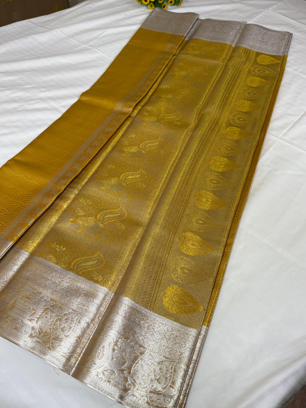 Golden Mustard Kanchipuram Silk Saree with Silver Zari & Dual-Tone Lotus Border