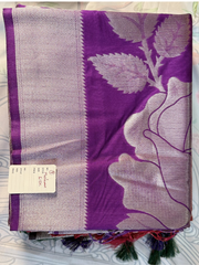 Purple scarf with floral design and brand tag on a white background