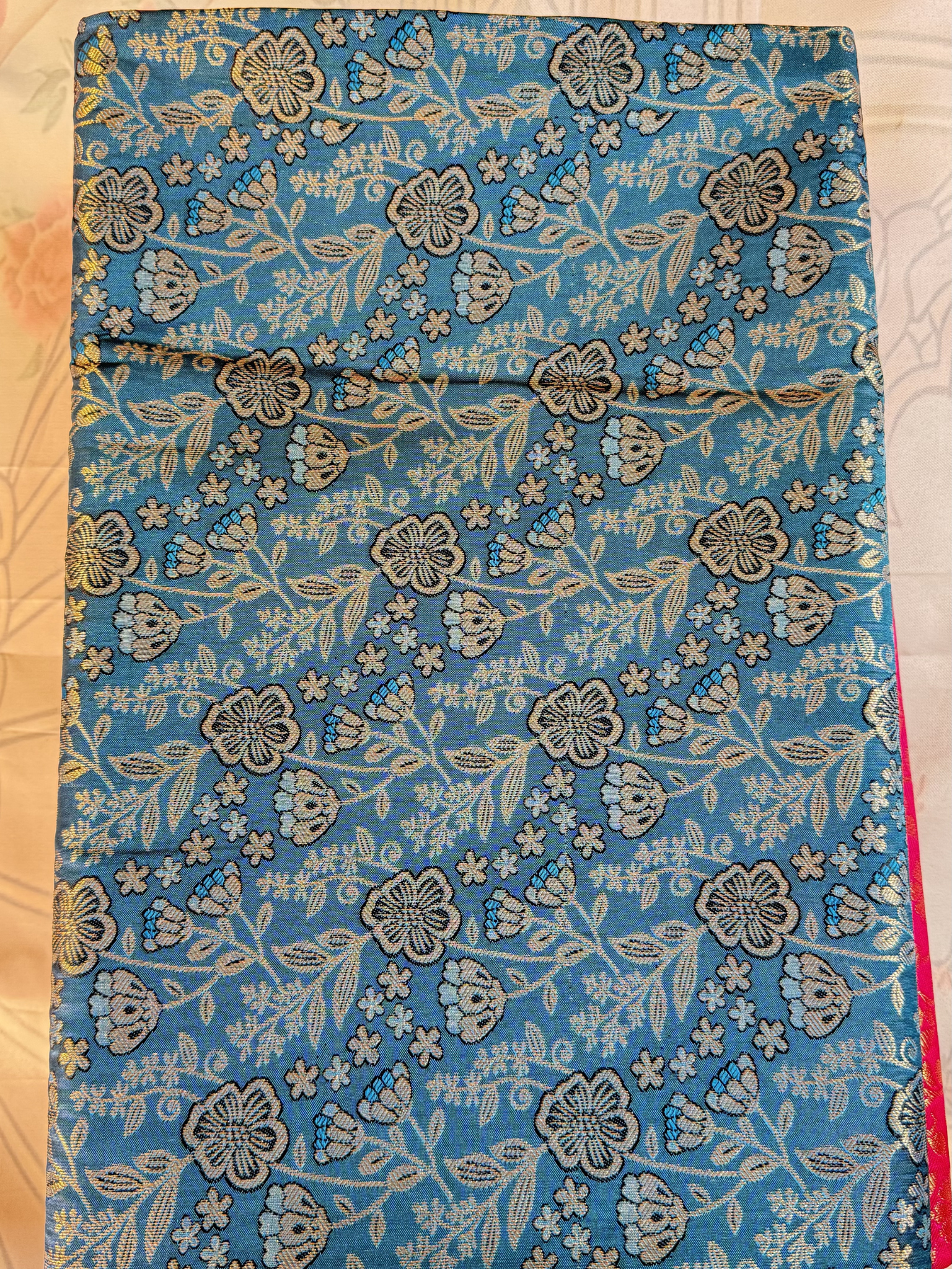 Floral patterned fabric on a wooden surface