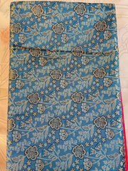 Floral patterned fabric on a wooden surface