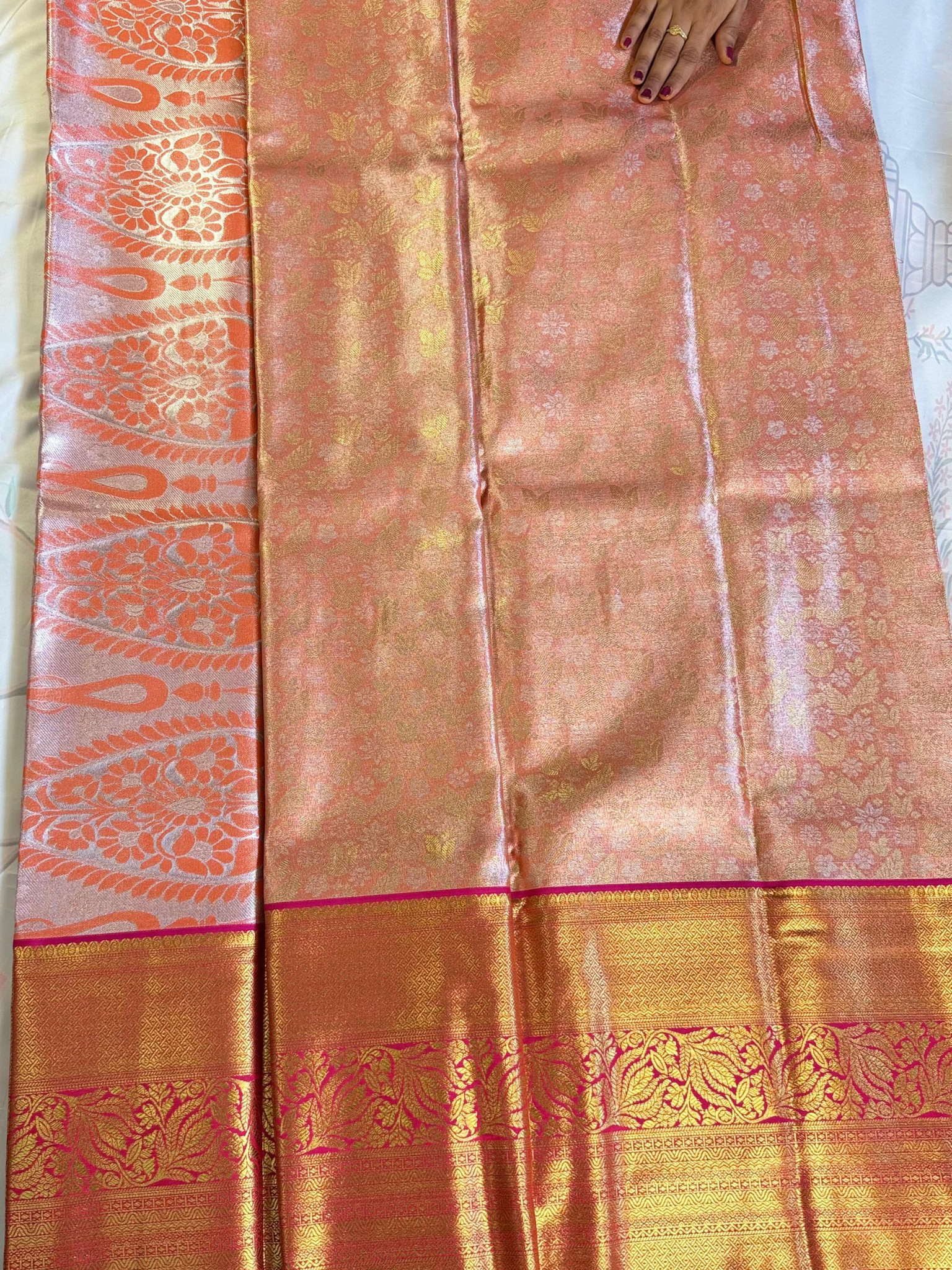 Traditional saree with a decorative border on a plain background