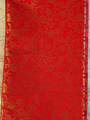 Red fabric with gold floral pattern