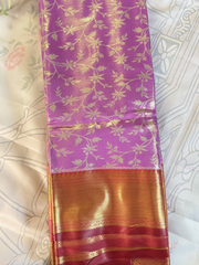 Yellow saree with a white and floral patterned background